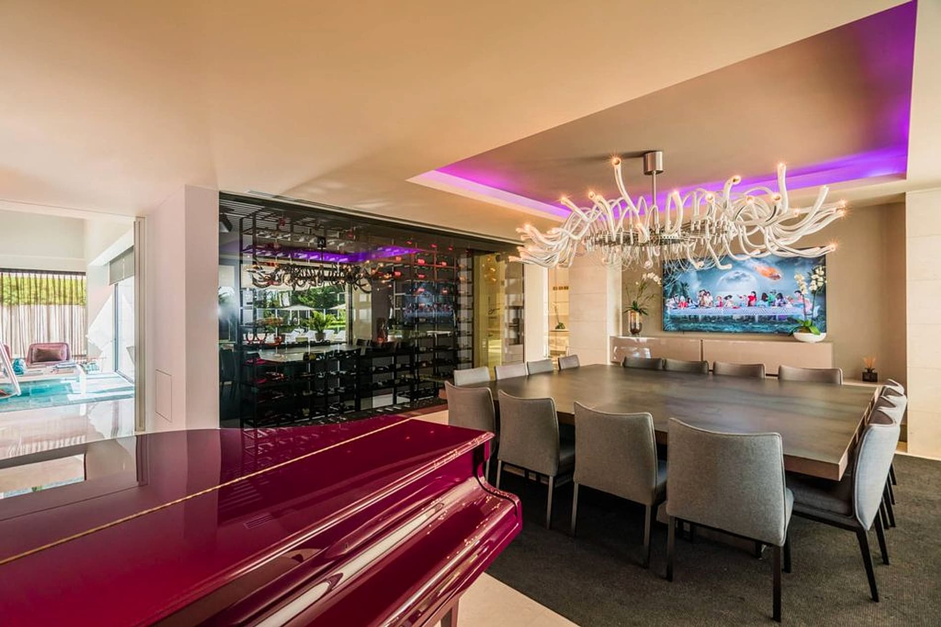 Entertainment room with piano, dining, wine storage, and ambient lighting