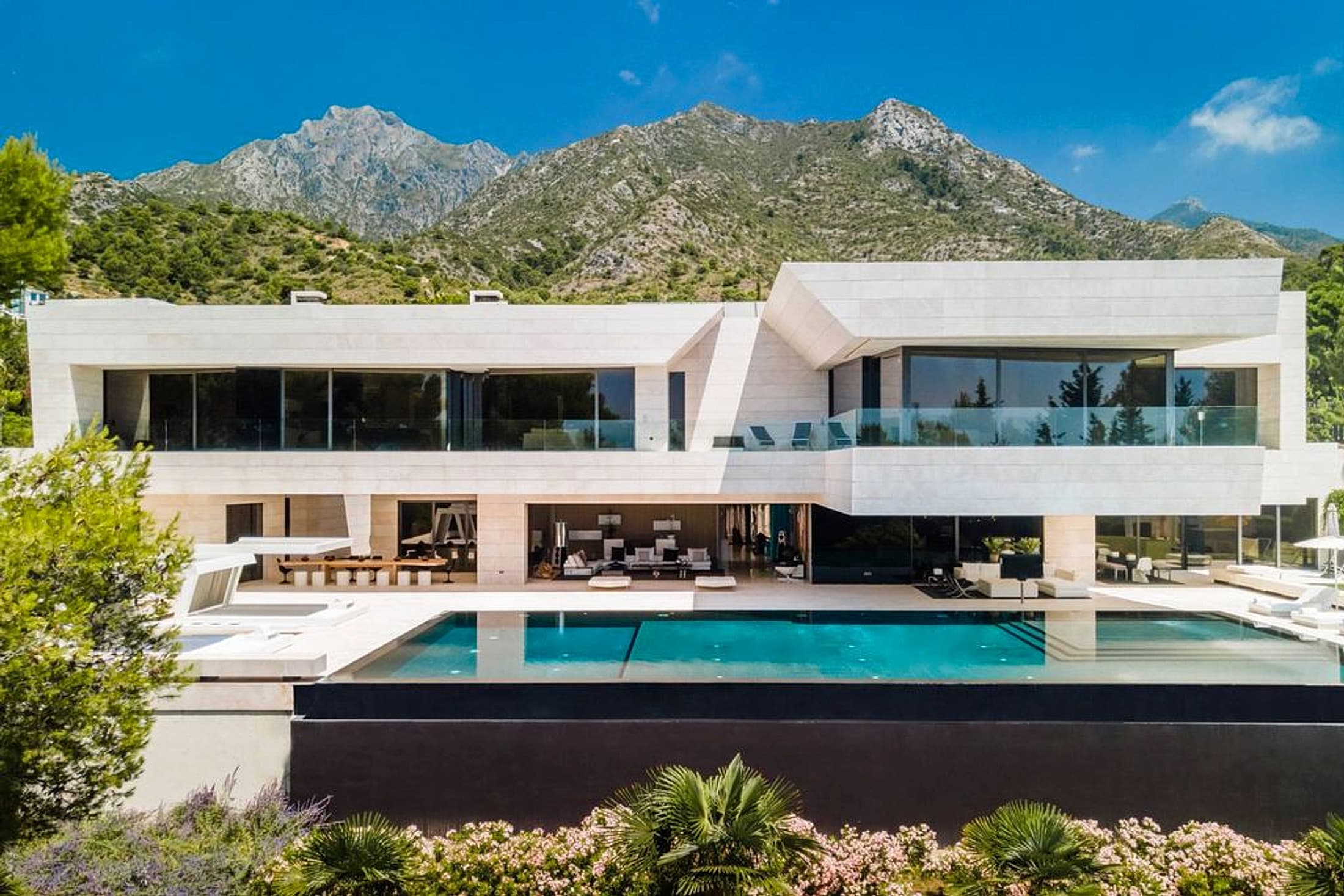 Marbella Private Experience modern private house with pool and mountain views at dusk