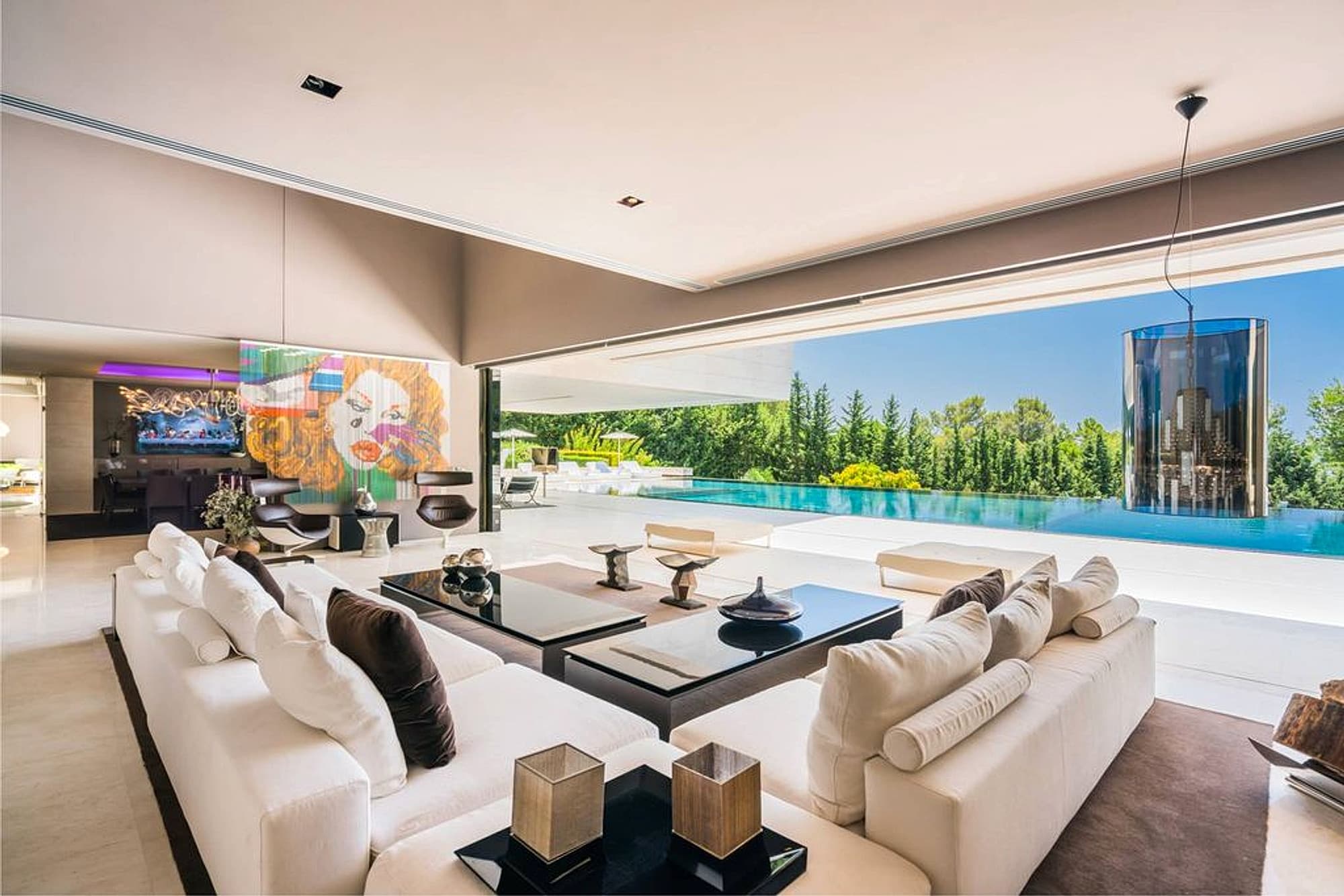 Luxury living room opening directly onto the pool terrace